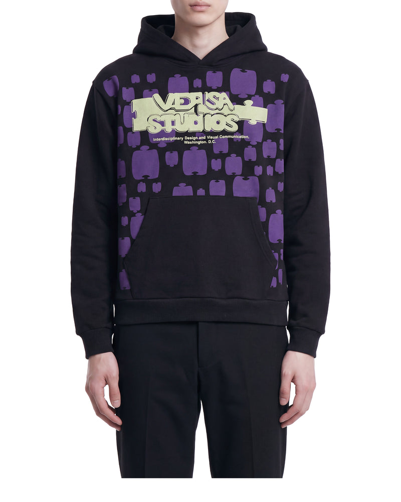 Versa Studios puzzle-print hoodie, on a model, front view