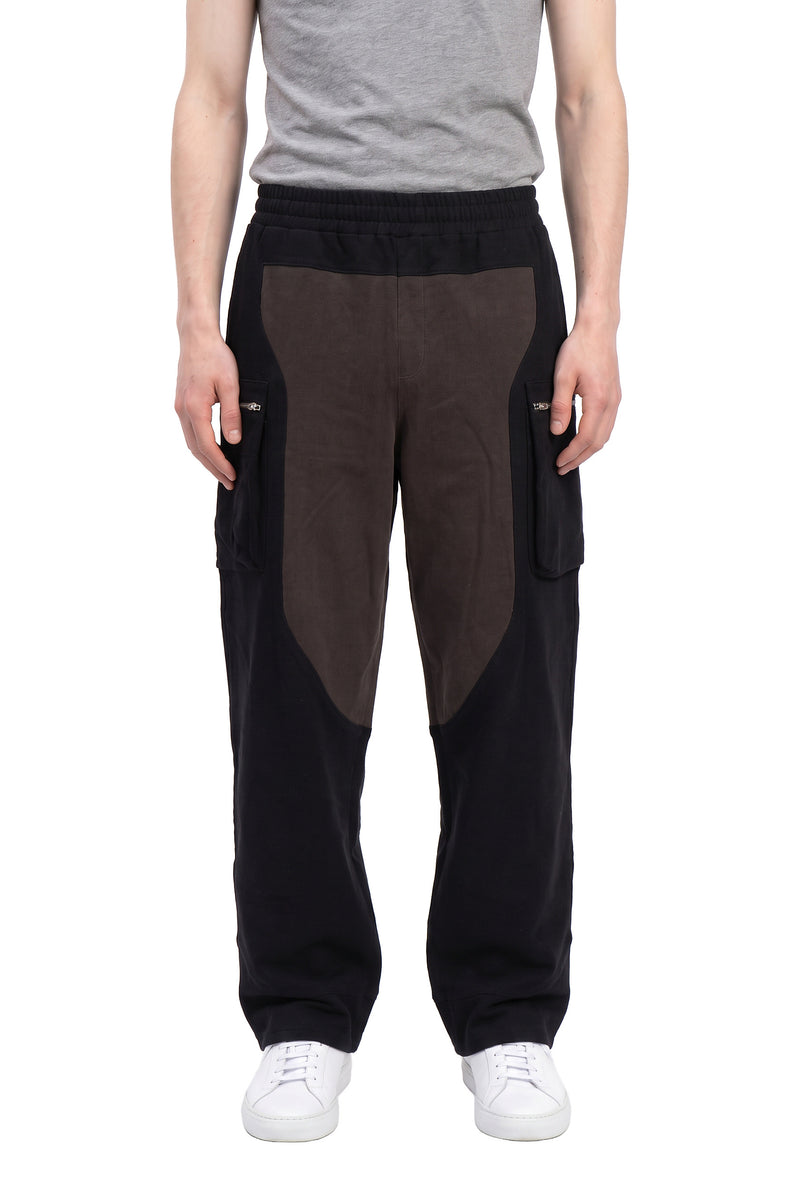 Saddle-panel knit pants, zip pockets, on a model, front view